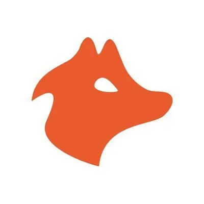 A minimalist orange logo depicting the head of a fox in profile, facing right, against a white background. The fox has a pointed snout, two ears, and an oval-shaped eye cutout.