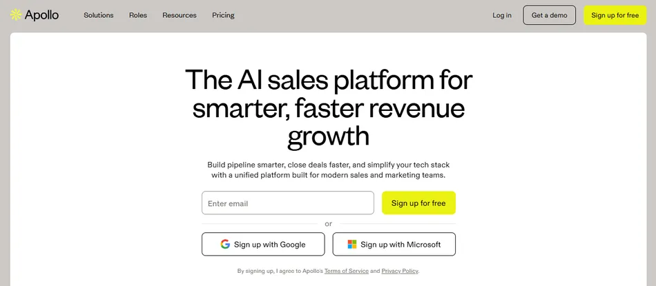 A screenshot of the Apollo website landing page. It features a prominent headline 'The AI sales platform for smarter, faster revenue growth' and an email signup form with buttons to 'Sign up for free', 'Sign up with Google', or 'Sign up with Microsoft'. The top navigation includes links for Solutions, Roles, Resources, Pricing, Log in, Get a demo, and Sign up for free.
