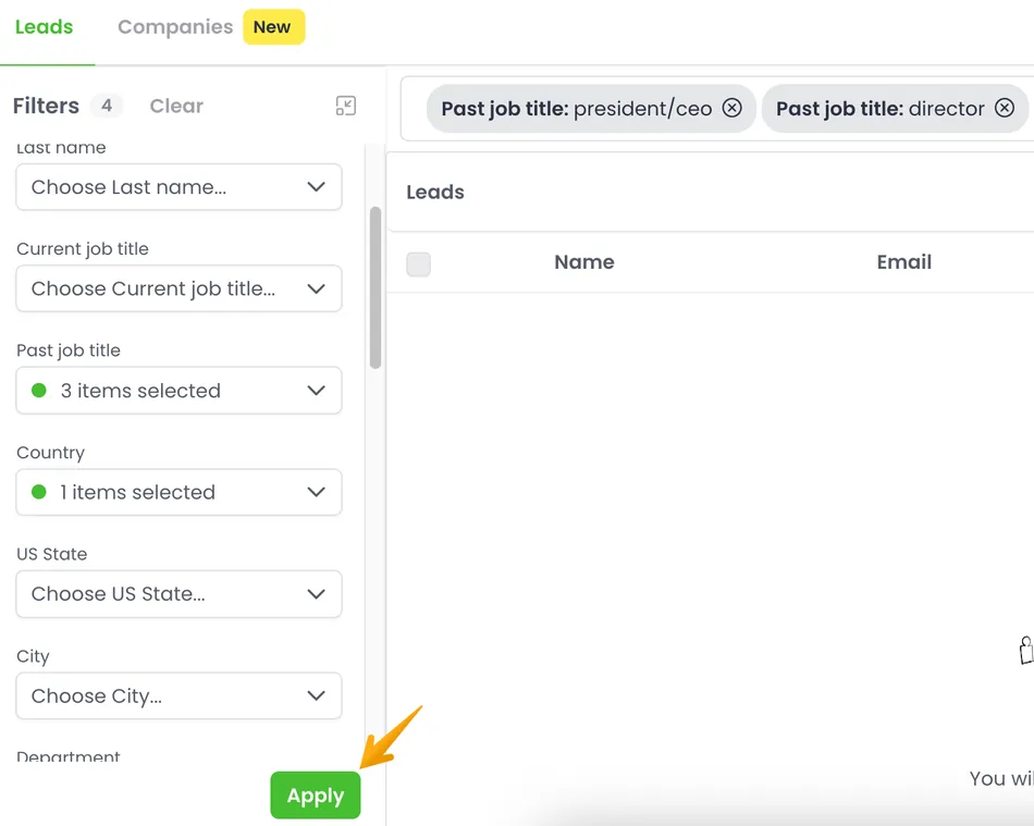 A screenshot of a web interface for filtering leads. The left panel shows various filter options such as Last name, Current job title, Past job title with 3 items selected, Country with 1 item selected, US State, City, and Department. An 'Apply' button is visible at the bottom of the filter panel. The right side shows an empty 'Leads' table with columns for Name and Email, and two active filters applied at the top: 'Past job title: president/ceo' and 'Past job title: director'. An orange arrow points to the 'Apply' button.